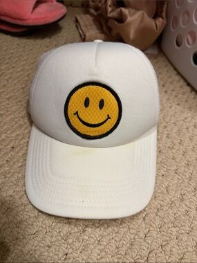 White Trucker Hat with Yellow Smiley Patch